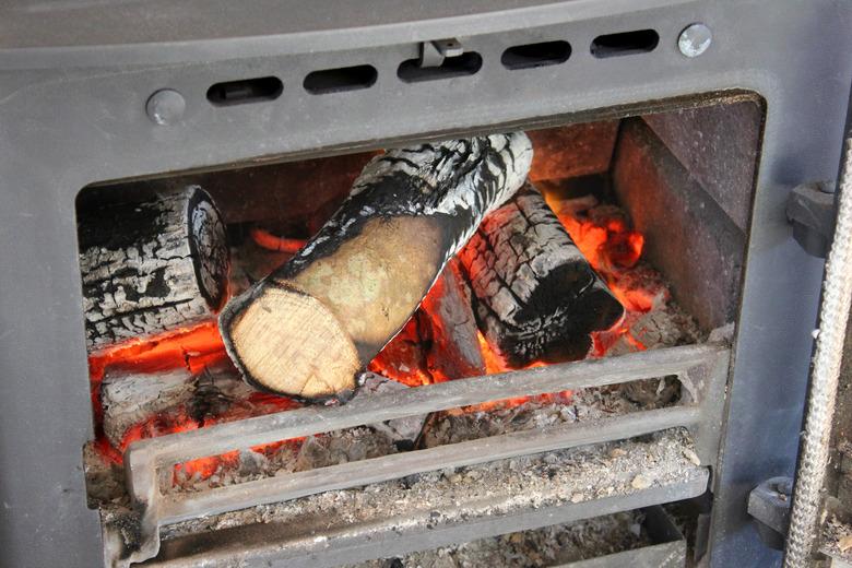 Image of fire grate, flames / burning logs, woodburner stove fireplace