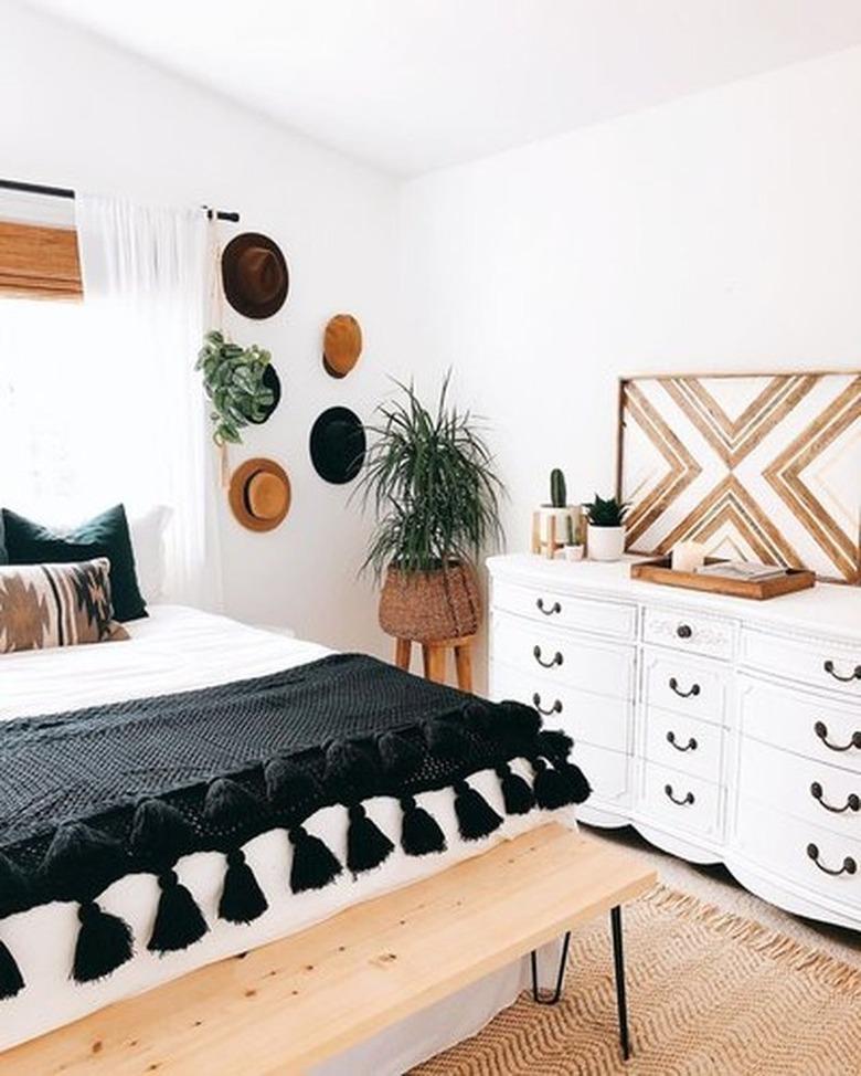 white bohemian bedroom with wooden accents