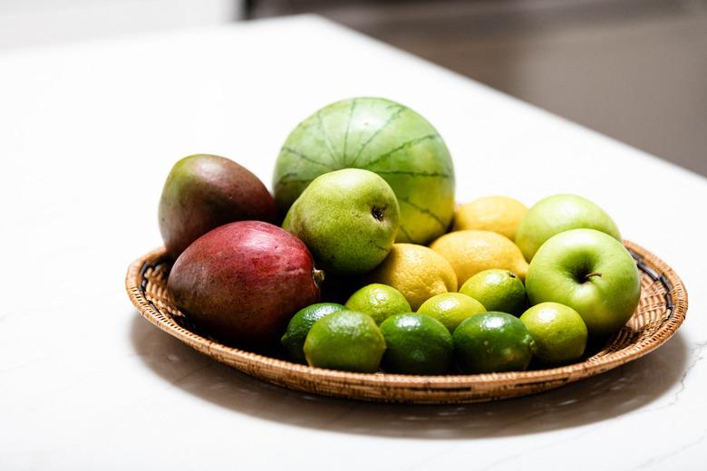 Produce in basket on kitchen counter