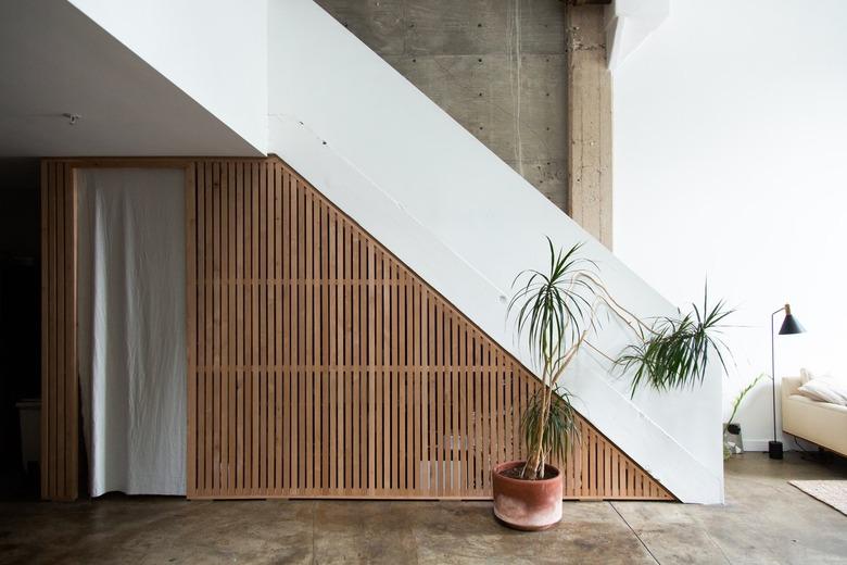 Loft staircase idea with wood plank design and palm tree