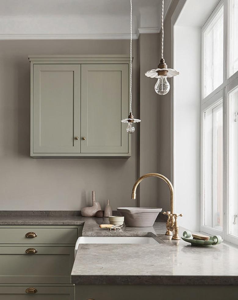 classic kitchen with beige limestone counters