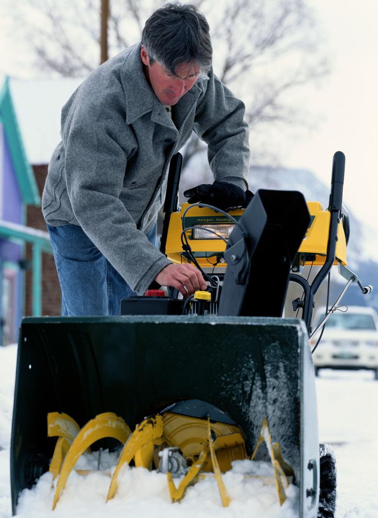 Man Starting a Snowblower