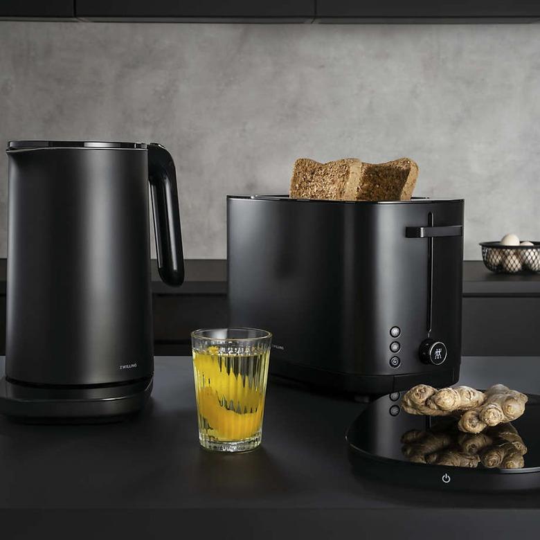 counter with black appliances including a kettle and toaster