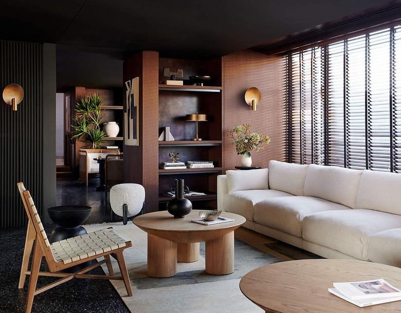 dark living room with light wood furniture