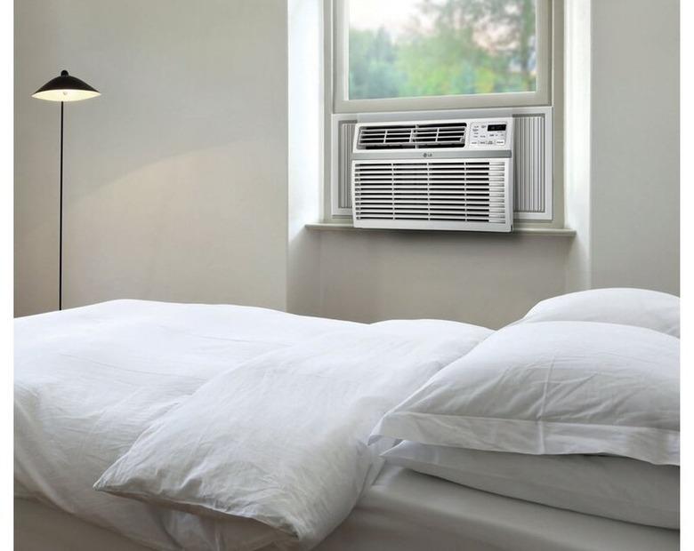 LG window air conditioner in gray and white bedroom