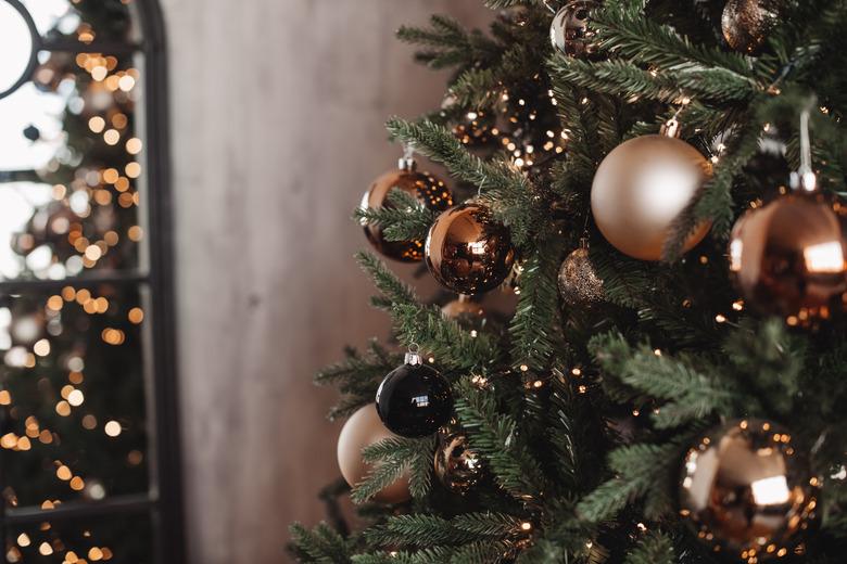 Christmas tree lights reflecting from glass balls and mirror