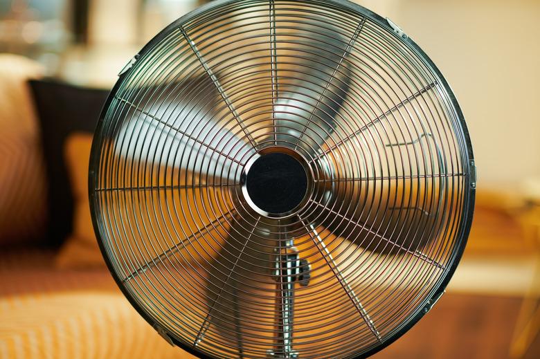 Closeup on working metallic floor standing fan