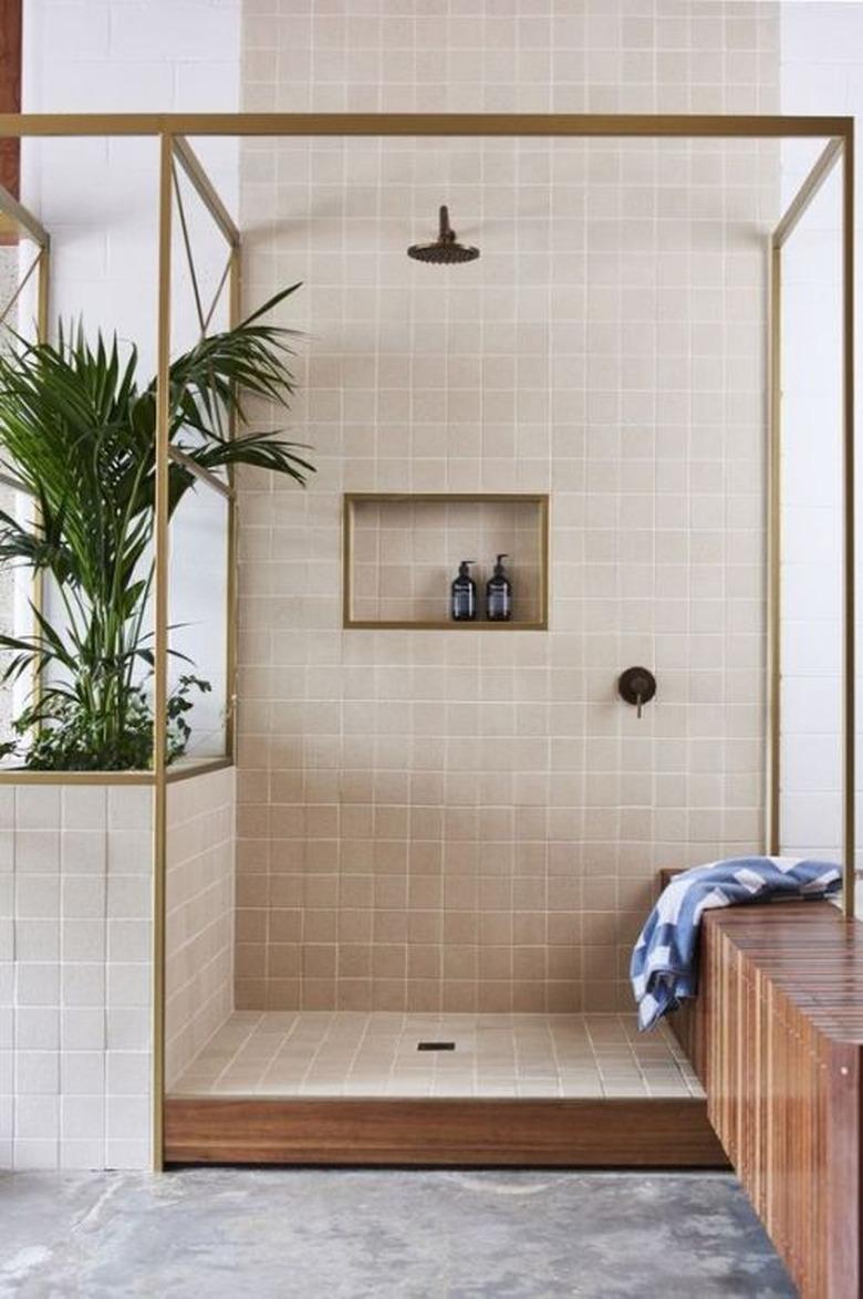 dusty pink open shower with brass frame