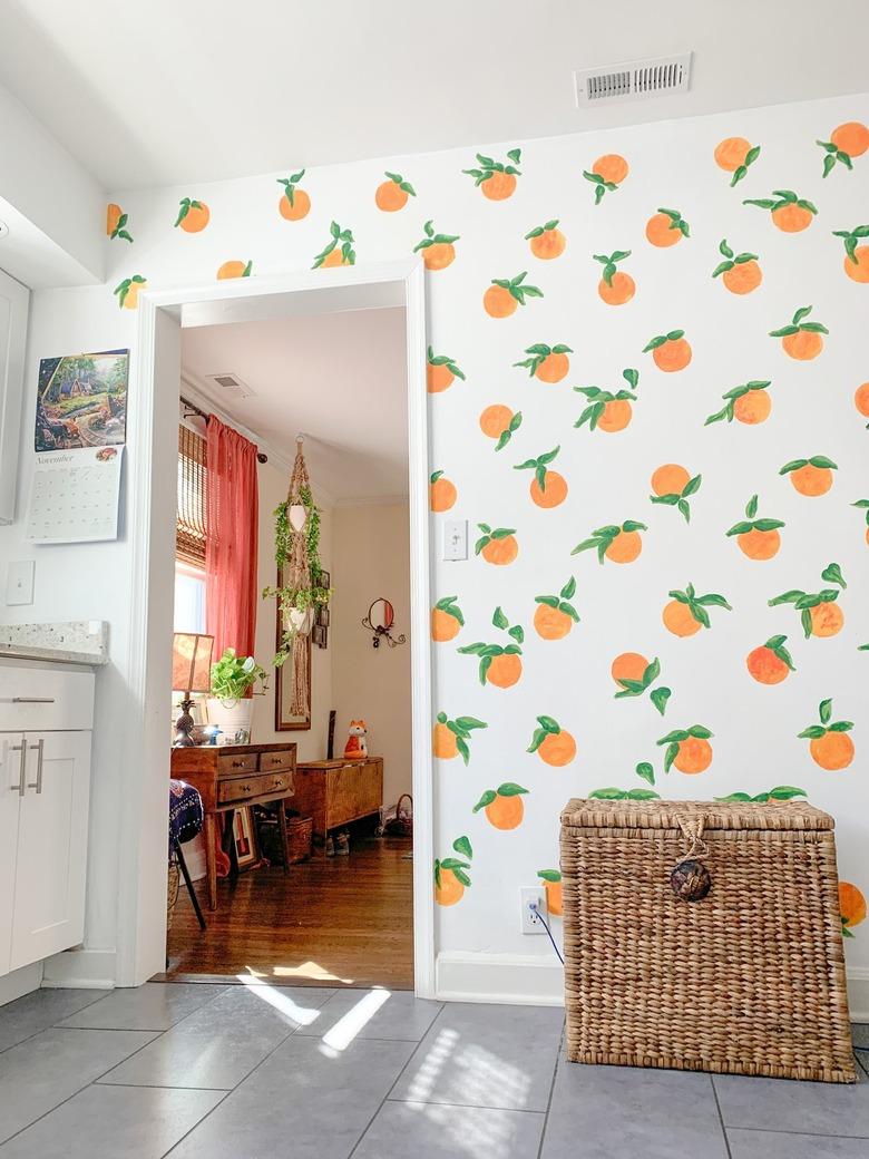 Hand painted oranges on kitchen wall