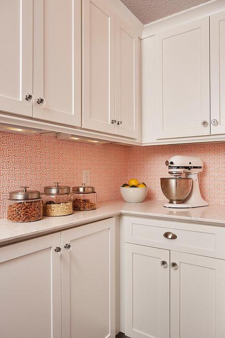 Kitchen pantry with orange and white wallpaper