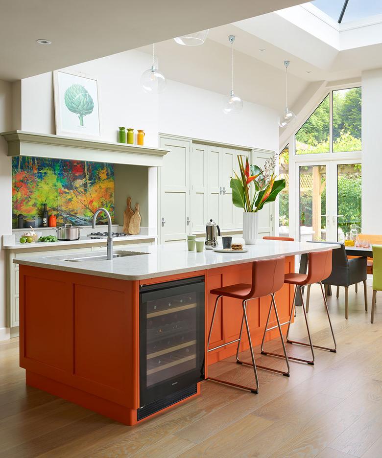 contemporary orange kitchen color idea with orange island and bar stools