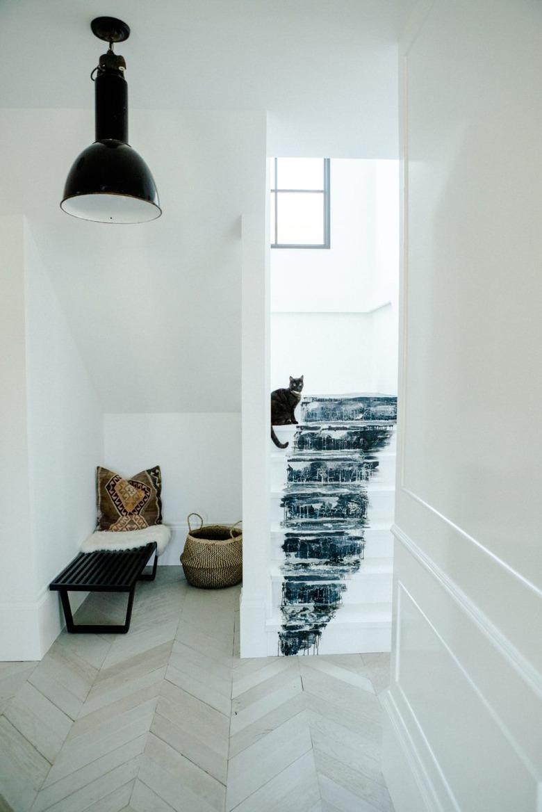 painted stairs with black and white abstract design