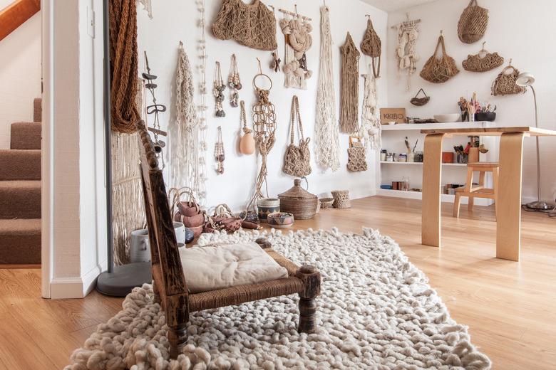 Macrame artwork on wall of living room