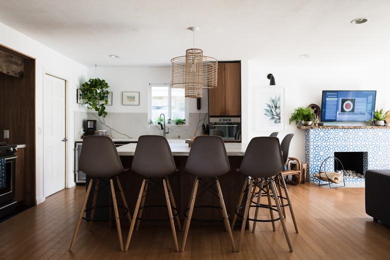 kitchen island with barstools and hardwood floors