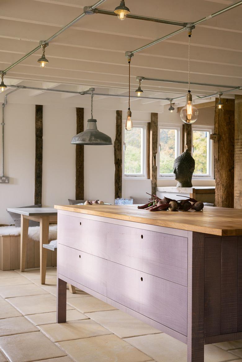 purple kitchen color idea with wood countertops and tile flooring