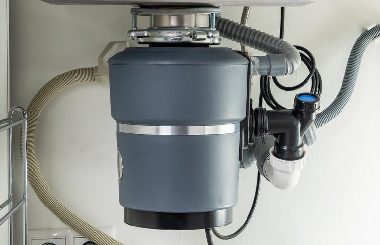 Garbage Disposal under the modern sink, waste chopper concept