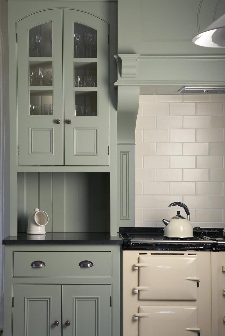 country kitchen with Raised Panel Cabinetry in muted green color