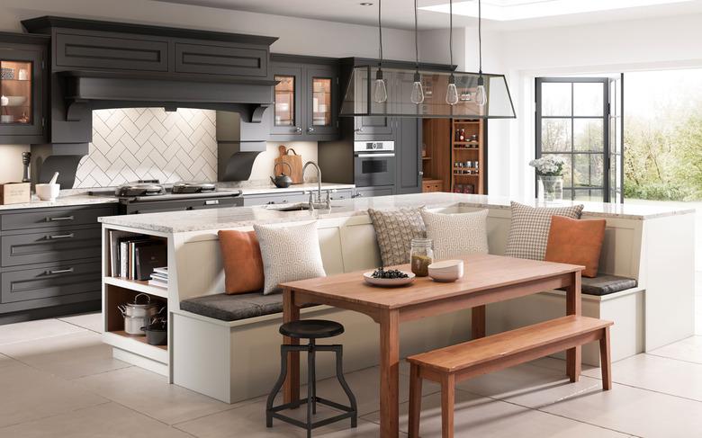 Spacious White L-shaped kitchen island with banquette seating