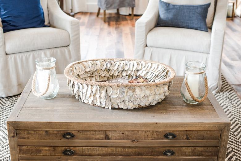 Rustic beach decor in living room with white chairs