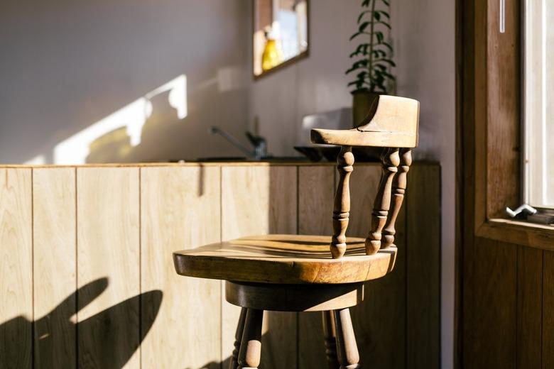 rustic decor in room with a frontier-style rustic wooden chair