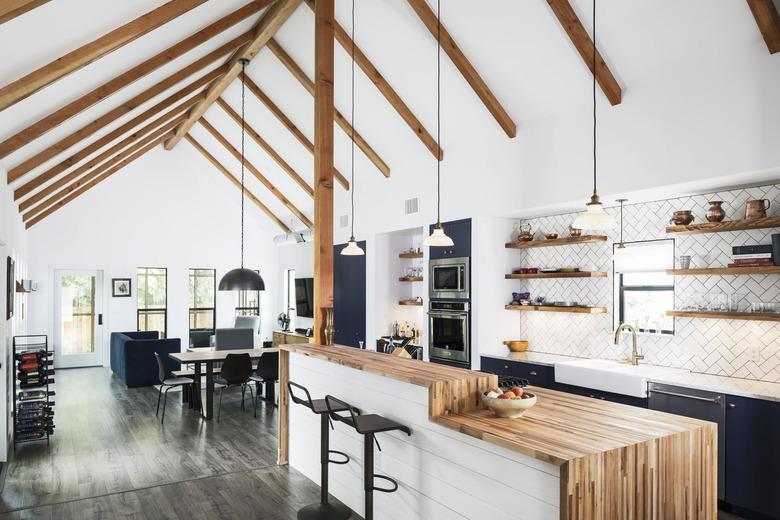 white kitchen with two tier rustic kitchen island