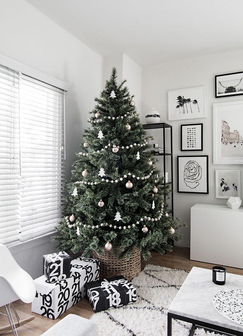 white living room with Scandinavian Christmas tree