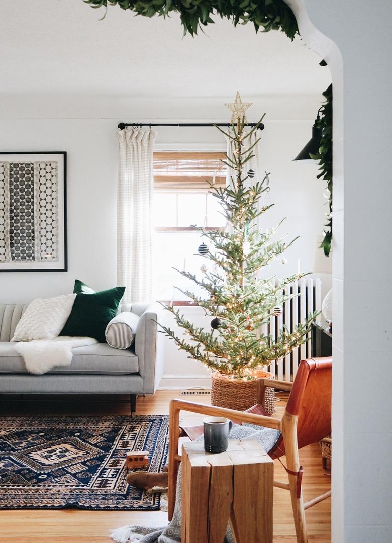 Scandinavian Christmas tree in the corner of a living room