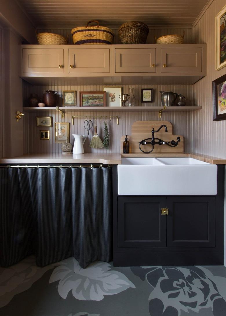 Dark moody kitchen with sleek black curtains