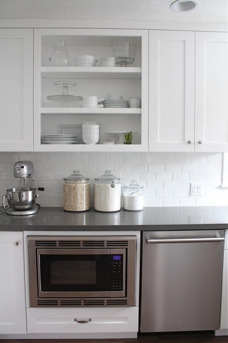 White and gray modern kitchen with solid surface countertops