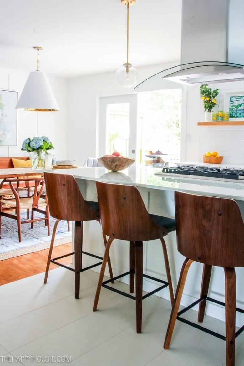 White and warm wood finish modern kitchen with with solid surface countertops