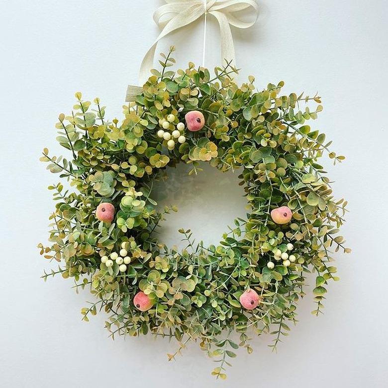 eucalyptus spring wreath with peaches and berries