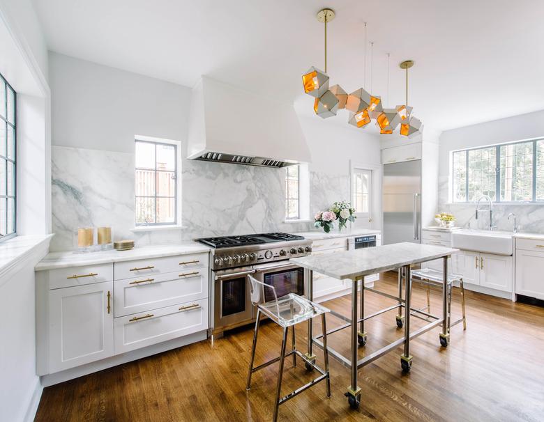 small stainless steel kitchen island with marble top