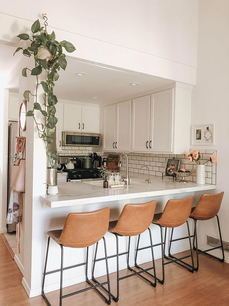 modern kitchen with white subway tile and dark grout