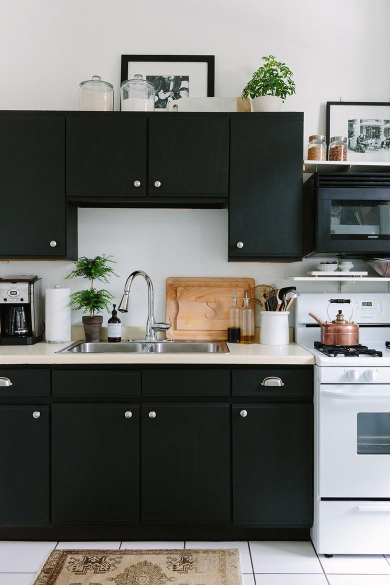 black kitchen cabinets in apartment