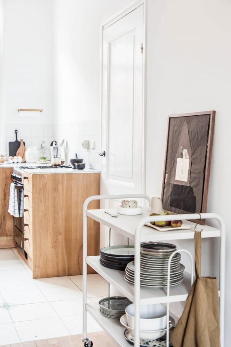 small kitchen with rolling cart for extra storage