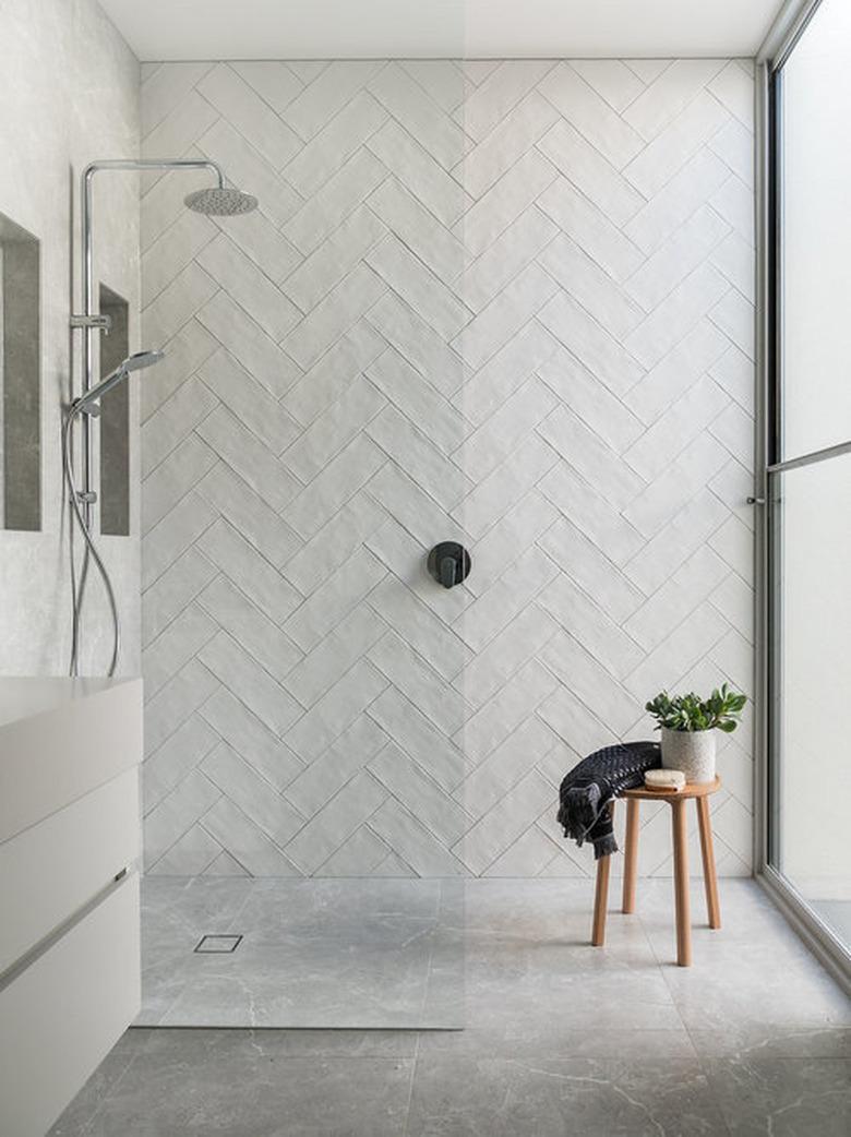 subway tile shower idea in herringbone pattern