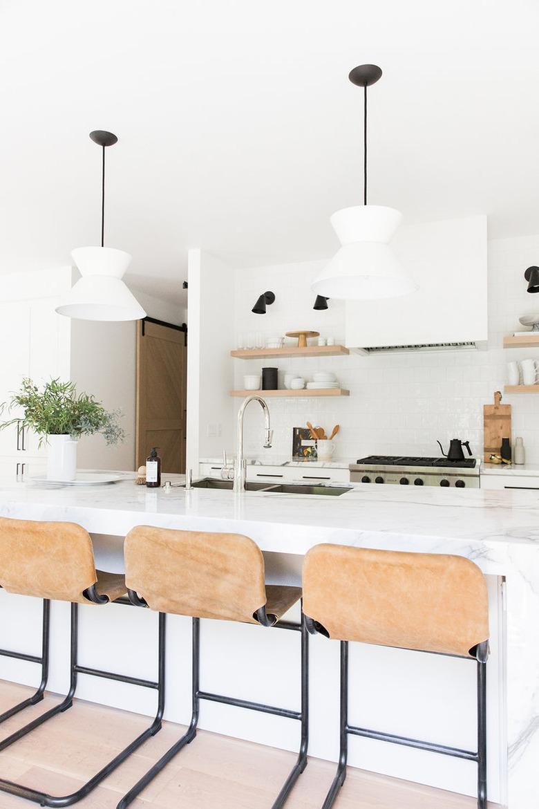 all white kitchen with open shelving and double sink