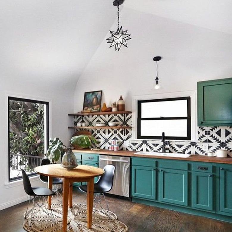 teal kitchen idea with black and white patterned backsplash