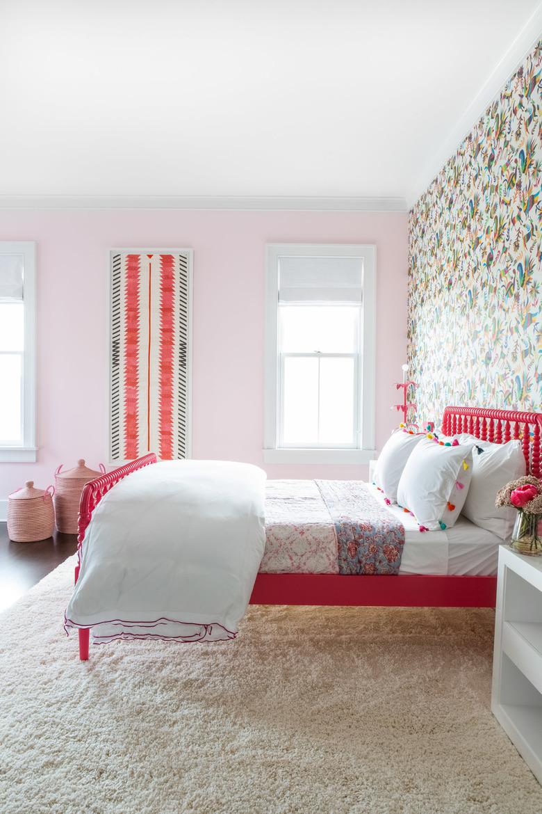 teen bedroom idea for girls with pink bed frame and patterned wallpaper with pink walls