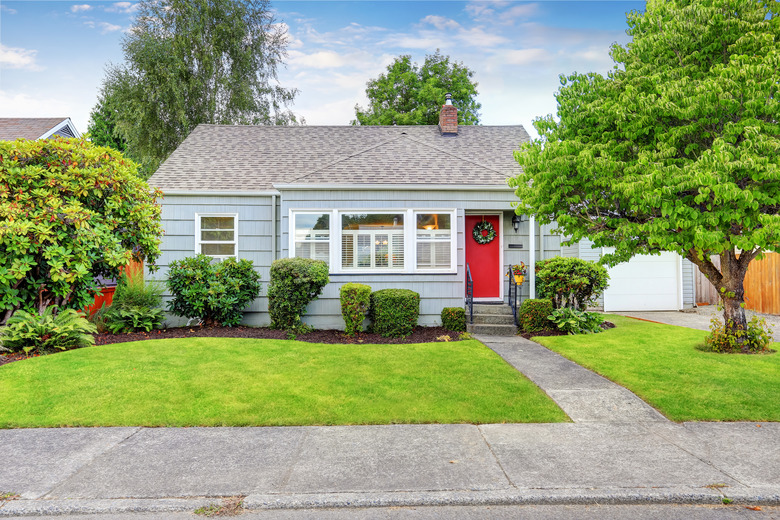 Exterior of small American house with blue paint