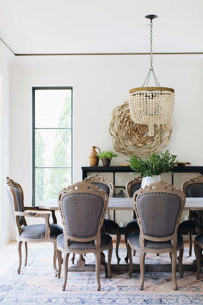 traditional dining room with beaded chandelier