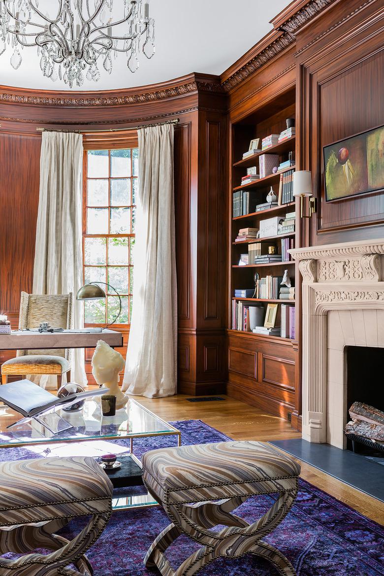 traditional home office with wood walls