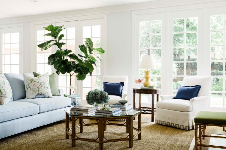 traditional living room with blue sofa and wood coffee table