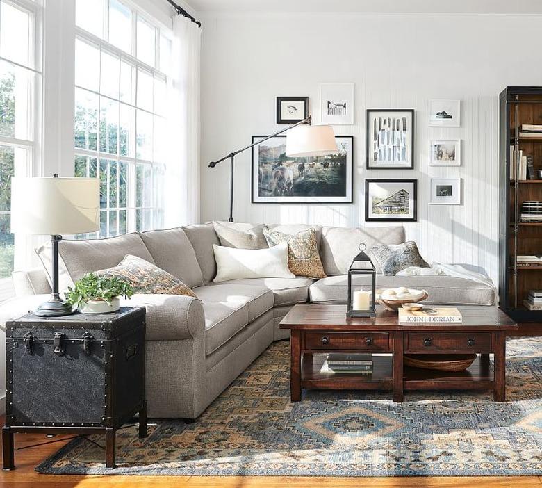 traditional living room with wooden coffee table and sectional sofa