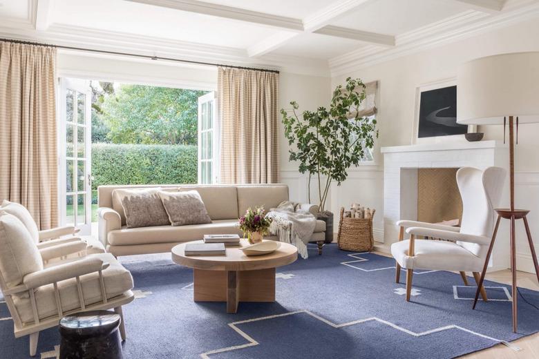 monochrome traditional living room with pop of blue