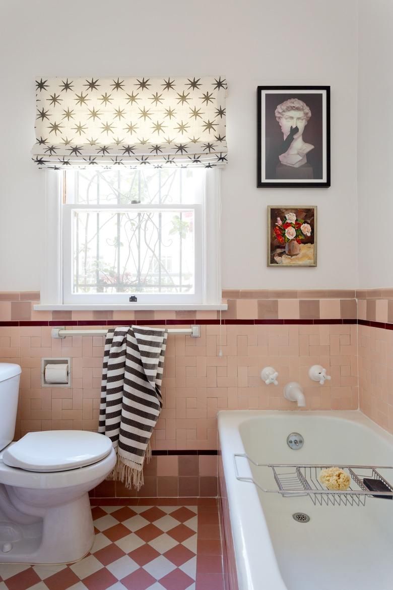 white and dusty pink bathroom colors with tub and pink tiles