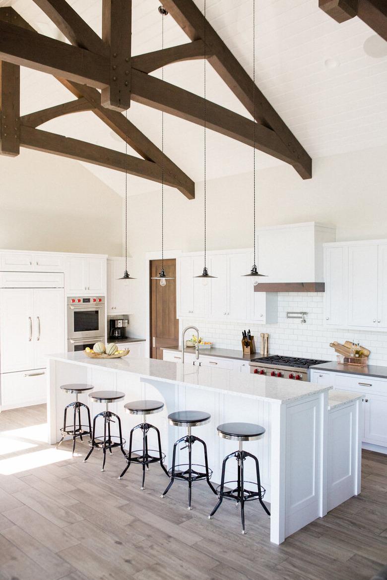 two tier kitchen island with white countertop and white base