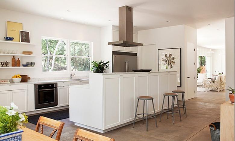 modern white two-tier kitchen island with cooktop