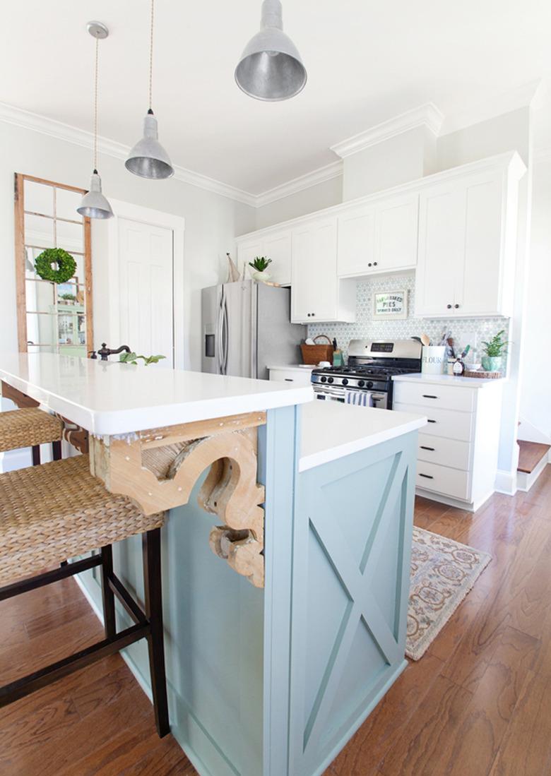 two tier kitchen island with blue base and white countertop