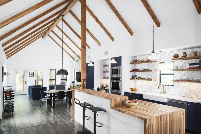 two tier kitchen island with wood countertop and white base